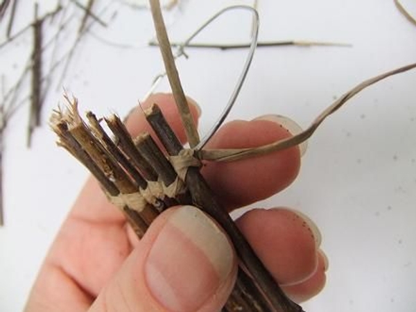 Move all around the wire adding twigs as you go Move all around the wire adding twigs as you go