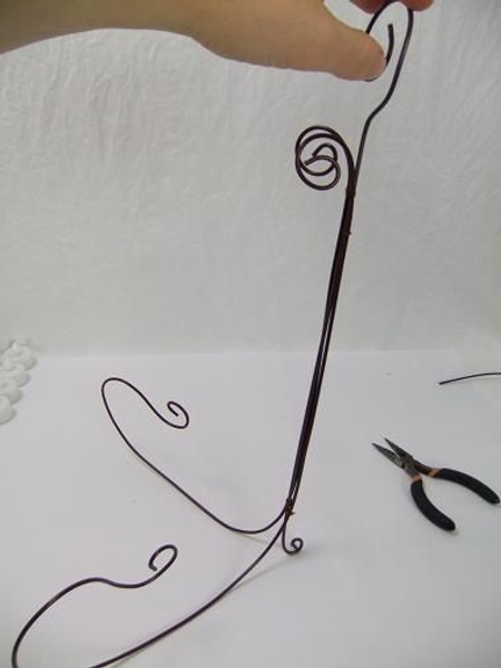 Rest the wire on the mid-curl and space it out Rest the wire on the mid-curl and space it out