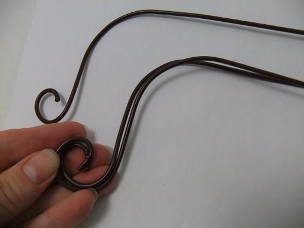Shape a third wire. Shape a third wire.