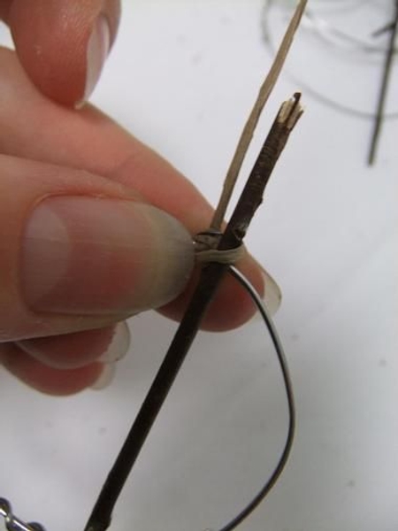 Tie the twigs to the bottom ring with bind wire. Tie the twigs to the bottom ring with bind wire.