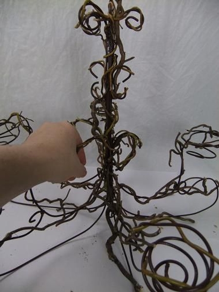 Use longer willow twigs to secure the other twigs Use longer willow twigs to secure the other twigs