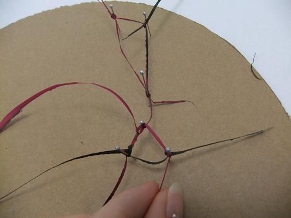 Carefully knot each strand to another strand and secure with a pin Carefully knot each strand to another strand and secure with a pin