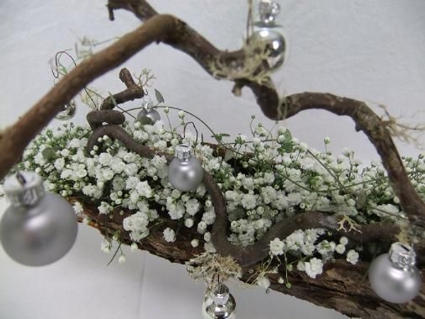 Hang a few baubles from mossy twigs. Hang a few baubles from mossy twigs.