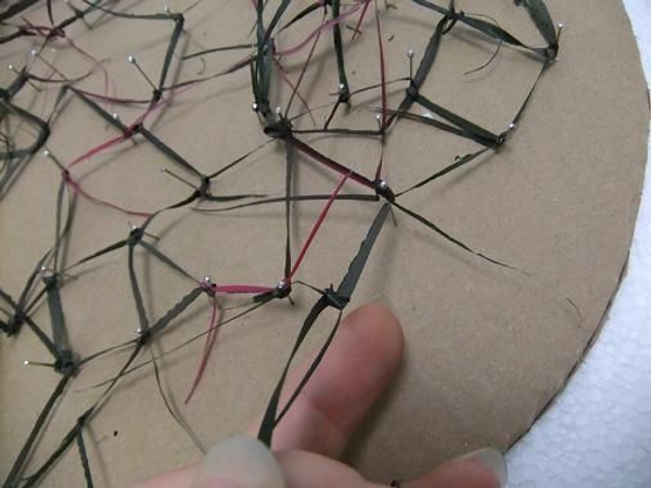 Knot each strand to at least two other strands. Knot each strand to at least two other strands.