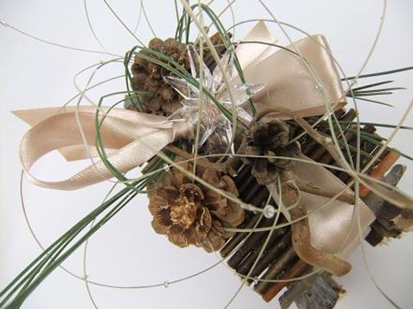 Pine needles, pine cones and ripped flax to decorate the twig gift box
