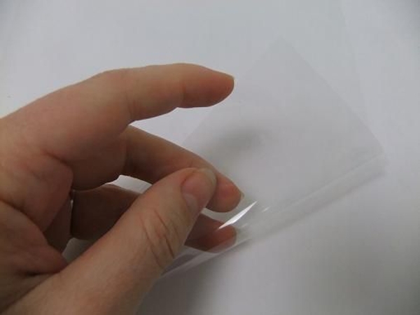 Place a sheet of plastic on a flat working surface