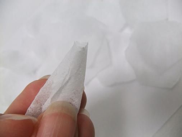 Roll the first two petals to shape the bud Roll the first two petals to shape the bud