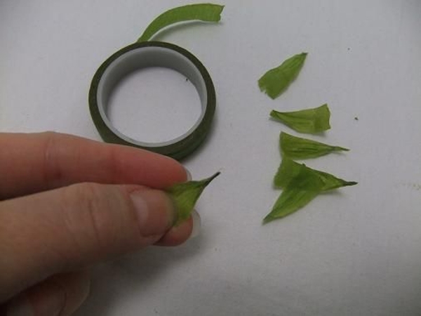 Shape sepals out of florist tape Shape sepals out of florist tape