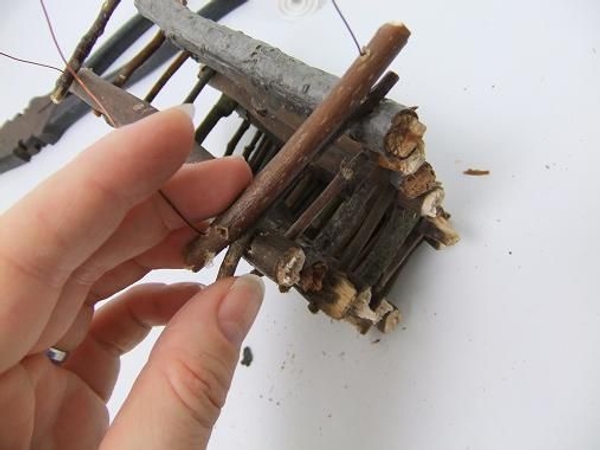 Start to stack the twigs to create a lid Start to stack the twigs to create a lid