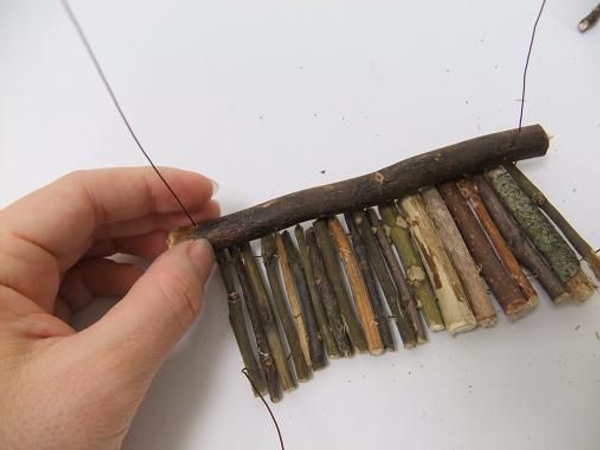 Thread the wire through the longer twig Thread the wire through the longer twig