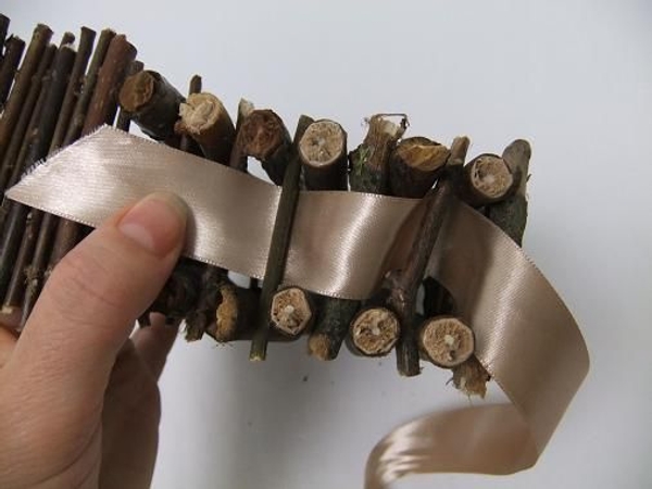 Weave the ribbon in and out of the twigs Weave the ribbon in and out of the twigs