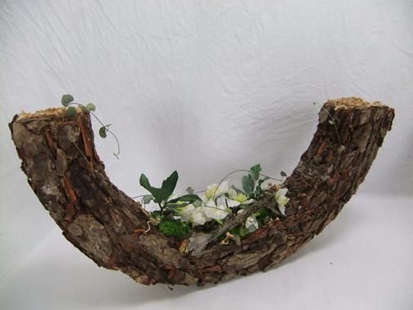 A bark chip veneer is a great way to create a precise shape that looks natural but can't be found in nature. A bark chip veneer is a great way to create a precise shape that looks natural but can't be found in nature.