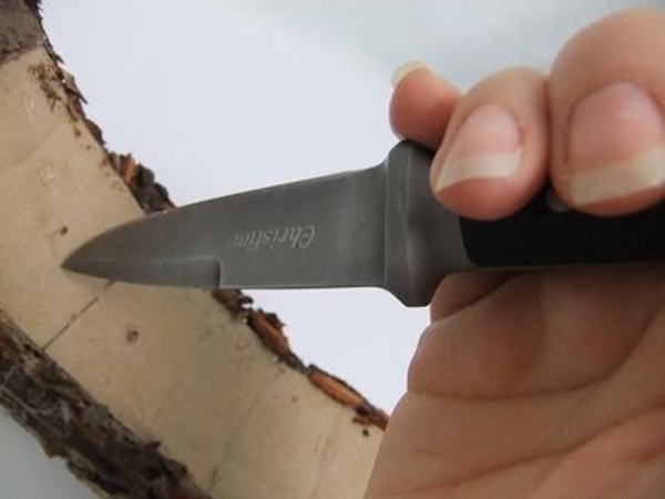 Cut a slit in the bottom cardboard with a sharp knife Cut a slit in the bottom cardboard with a sharp knife