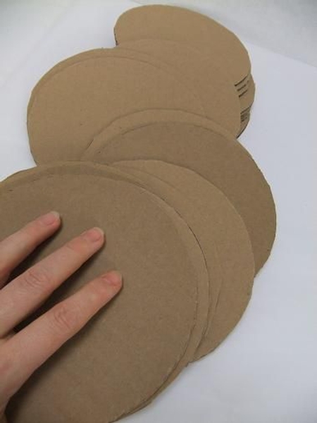 Cut a stack of cardboard circles. Cut a stack of cardboard circles.