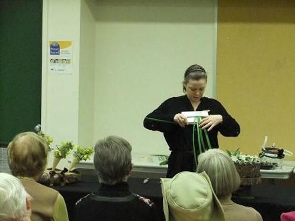 Demonstrating how to weave Demonstrating how to weave
