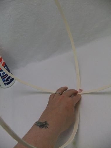 Measure out two sections of midelino cane coils and glue it in the middle point Measure out two sections of midelino cane coils and glue it in the middle point