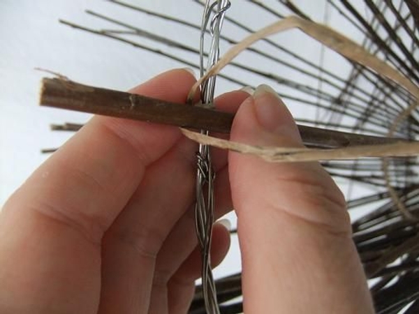 Tie the twigs to the larger wire circle Tie the twigs to the larger wire circle
