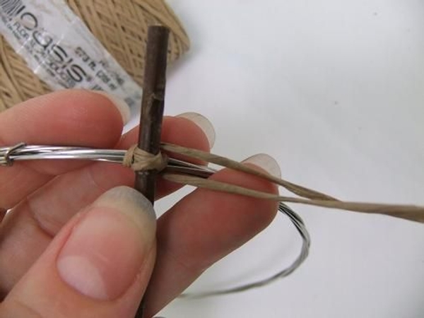 Wrap the wire around at both sides of the cross and move both ends of wire to the side Wrap the wire around at both sides of the cross and move both ends of wire to the side