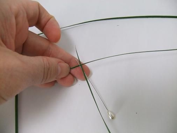 Add a third strand next to the first. Add a third strand next to the first.