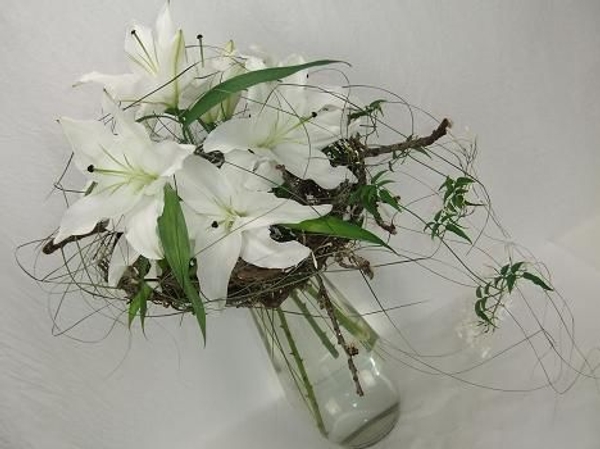 Drape the ripped leaves over the lilies and jasmine tendrils. Drape the ripped leaves over the lilies and jasmine tendrils.