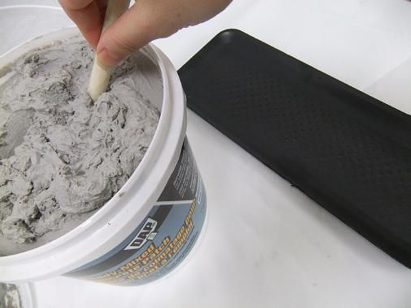 Mix up a batch of cement according to the container specifications Mix up a batch of cement according to the container specifications