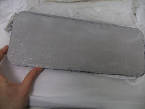 Open the concrete tray and place in a warm area Open the concrete tray and place in a warm area
