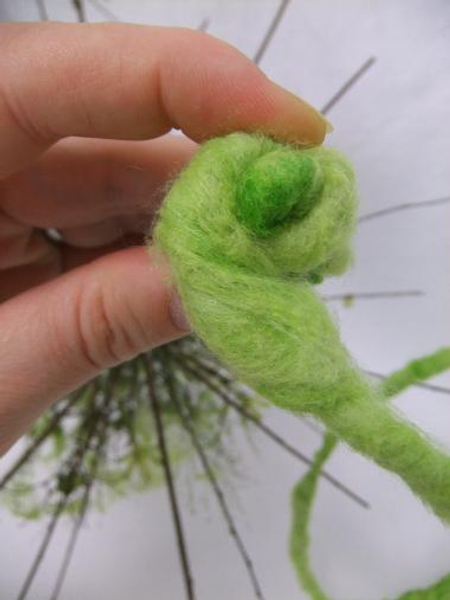 Start at the bottom of the dried Hydrangea stem and cover it with wool wire.