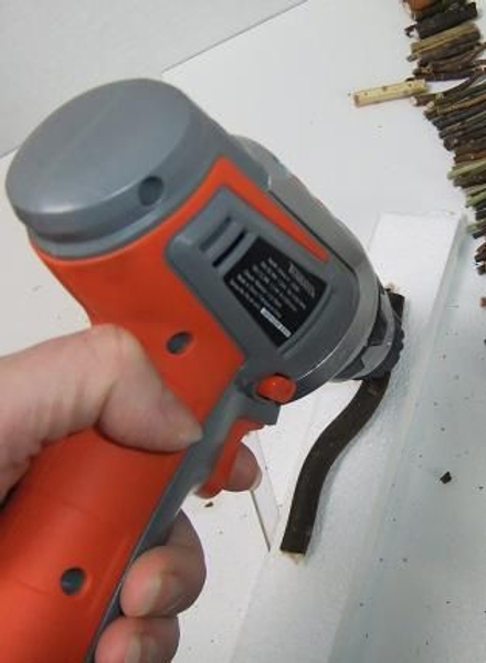Drill a small hole on both ends of the twig Drill a small hole on both ends of the twig
