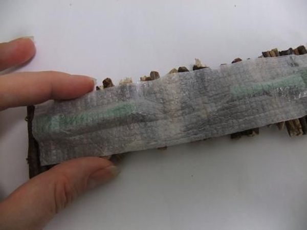 Glue the foam sheet over the magnet sticks and onto the twigs Glue the foam sheet over the magnet sticks and onto the twigs