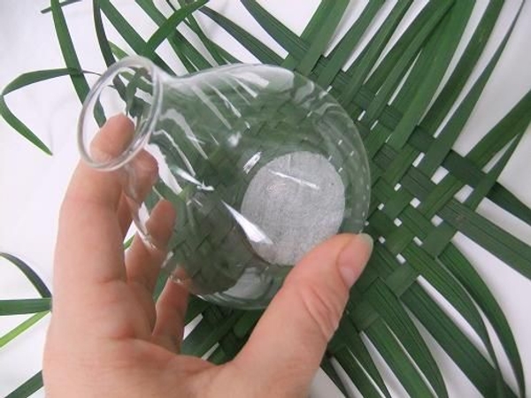 Rest the small bubble vase on the woven carpet Rest the small bubble vase on the woven carpet