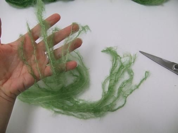 Cut eight long strands of wool for every hanging vase