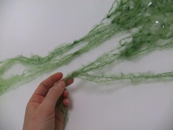 Divide the strands again and let two dangle down the vase Divide the strands again and let two dangle down the vase