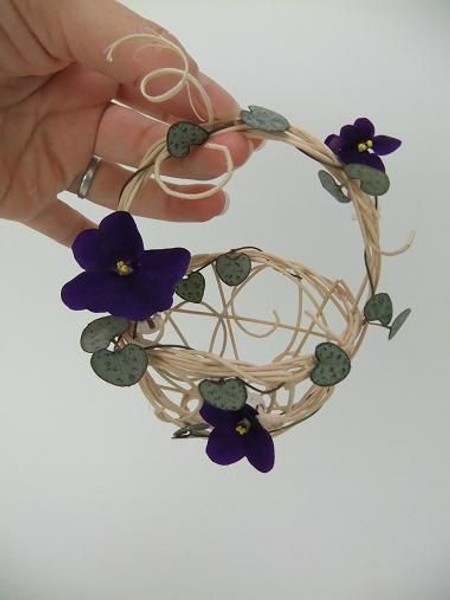 African Violets and Rosary Vine in a tiny rattan basket. African Violets and Rosary Vine in a tiny rattan basket.