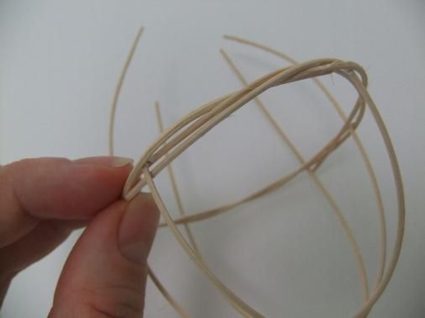 Hook the end piece into the wreath to secure Hook the end piece into the wreath to secure
