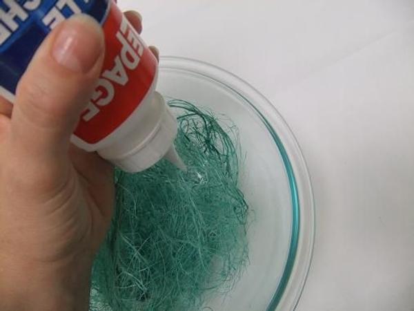 Pour some wood glue into a bowl filled with sisal Pour some wood glue into a bowl filled with sisal