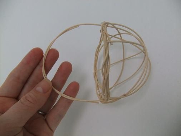 Weave the pieces together to secure the handle Weave the pieces together to secure the handle