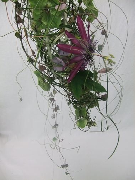 Dangle long stems of rosary vine loosely down the design Dangle long stems of rosary vine loosely down the design