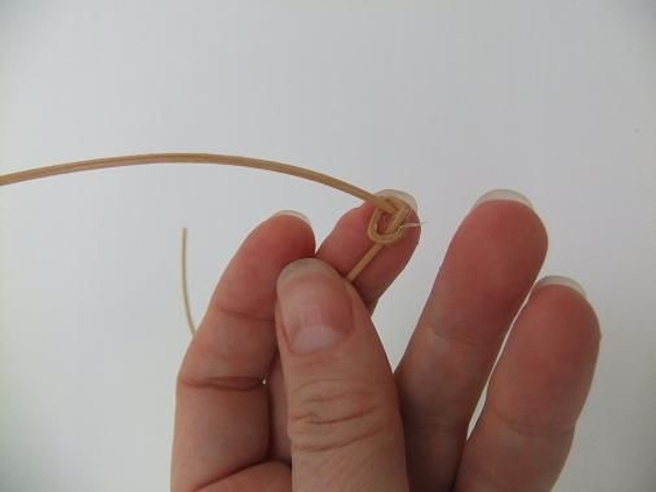 Knot a length of rattan Knot a length of rattan