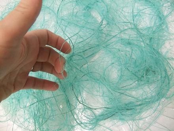 Lift up a few strands to create pockets for the flowers Lift up a few strands to create pockets for the flowers