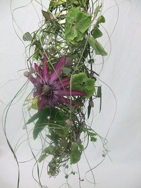 Wrap and weave and twirl ripped flax to create a summer floral nest. Wrap and weave and twirl ripped flax to create a summer floral nest.