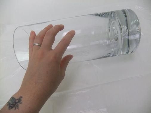 Set a vase on its side on a plastic lined working surface. Set a vase on its side on a plastic lined working surface.