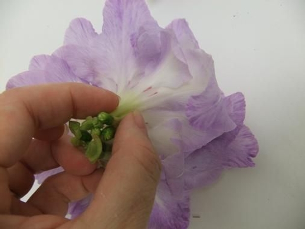 Continue to build up the flower by adding more split flowers Continue to build up the flower by adding more split flowers
