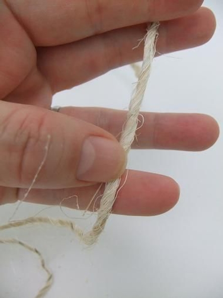 Cut a length of sisal string Cut a length of sisal string