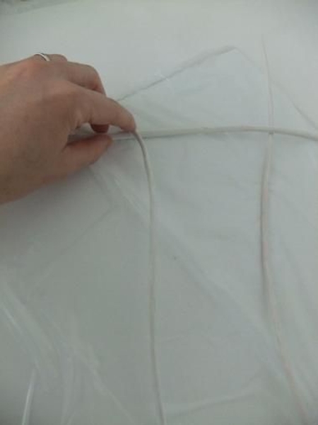 Paint a few twigs white and lay them on a flat surface Paint a few twigs white and lay them on a flat surface