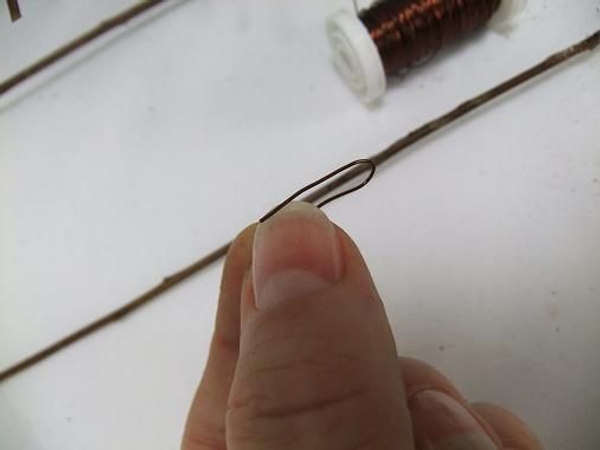 Bend a wire to pin more twigs in to place. Bend a wire to pin more twigs in to place.