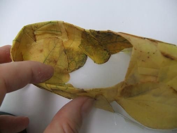Cover the paper slipper with fall leaves Cover the paper slipper with fall leaves