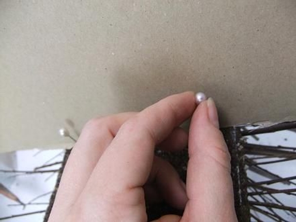 Place the cardboard on the foam block and secure with four pins Place the cardboard on the foam block and secure with four pins