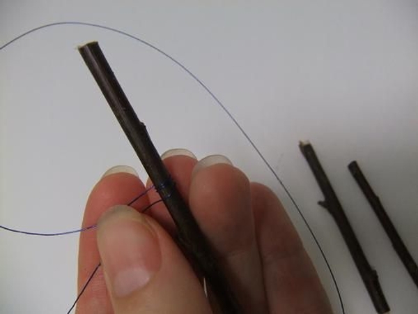 Wrap the wire around the twig a few times Wrap the wire around the twig a few times