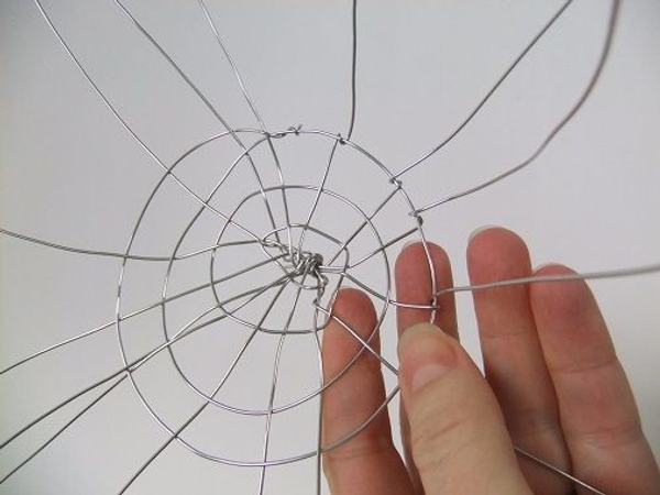 Continue around the spiral and secure all the spike wires Continue around the spiral and secure all the spike wires
