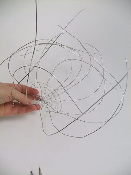 Curve each wire to make a round cauldron Curve each wire to make a round cauldron